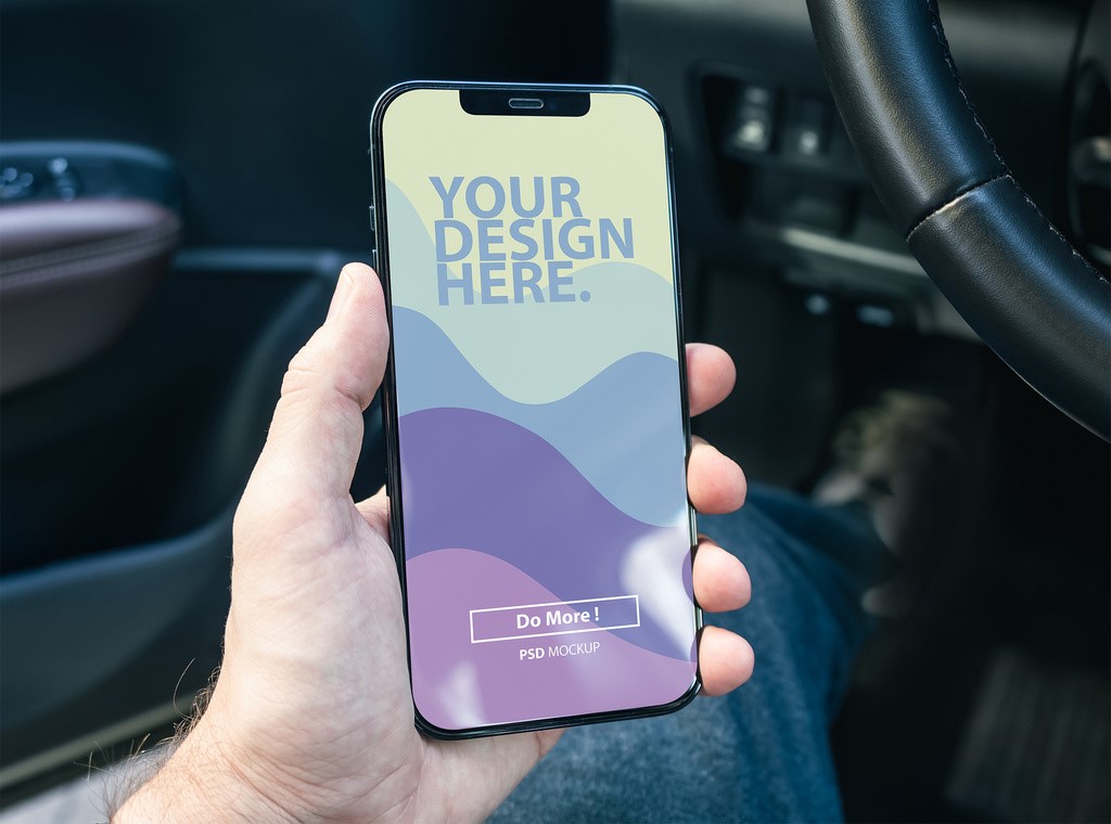 modern-smartphone-mockup-in-mans-hand-in-modern-car-interior-psd